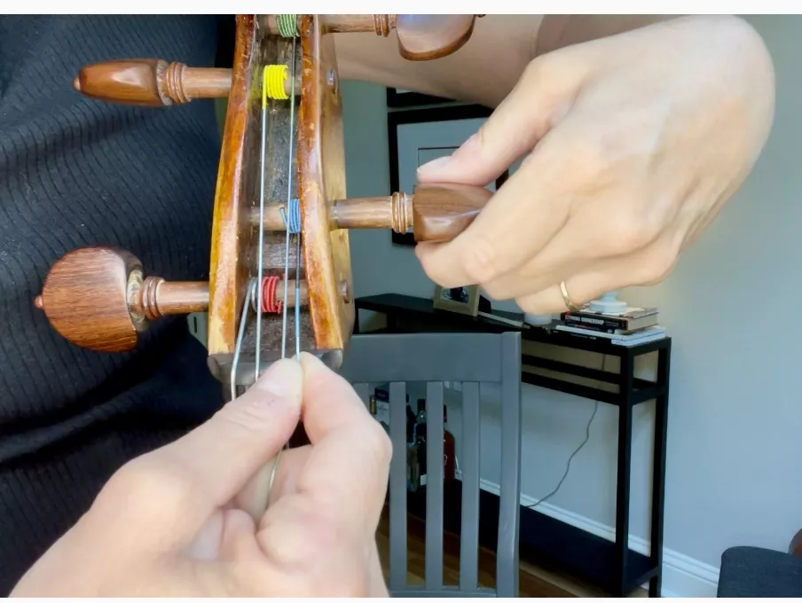 Attaching cello strings.jpg